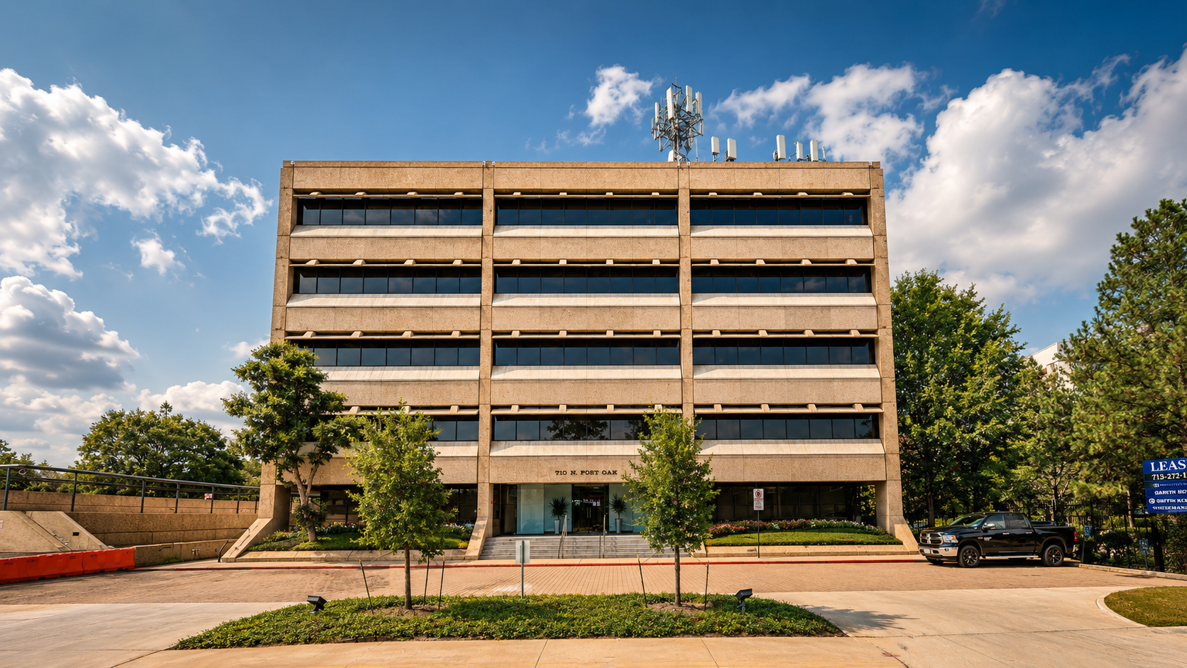 Exterior of 710 N. Post Oak Road — modern commercial office tower in the Memorial/Galleria submarket of Houston
